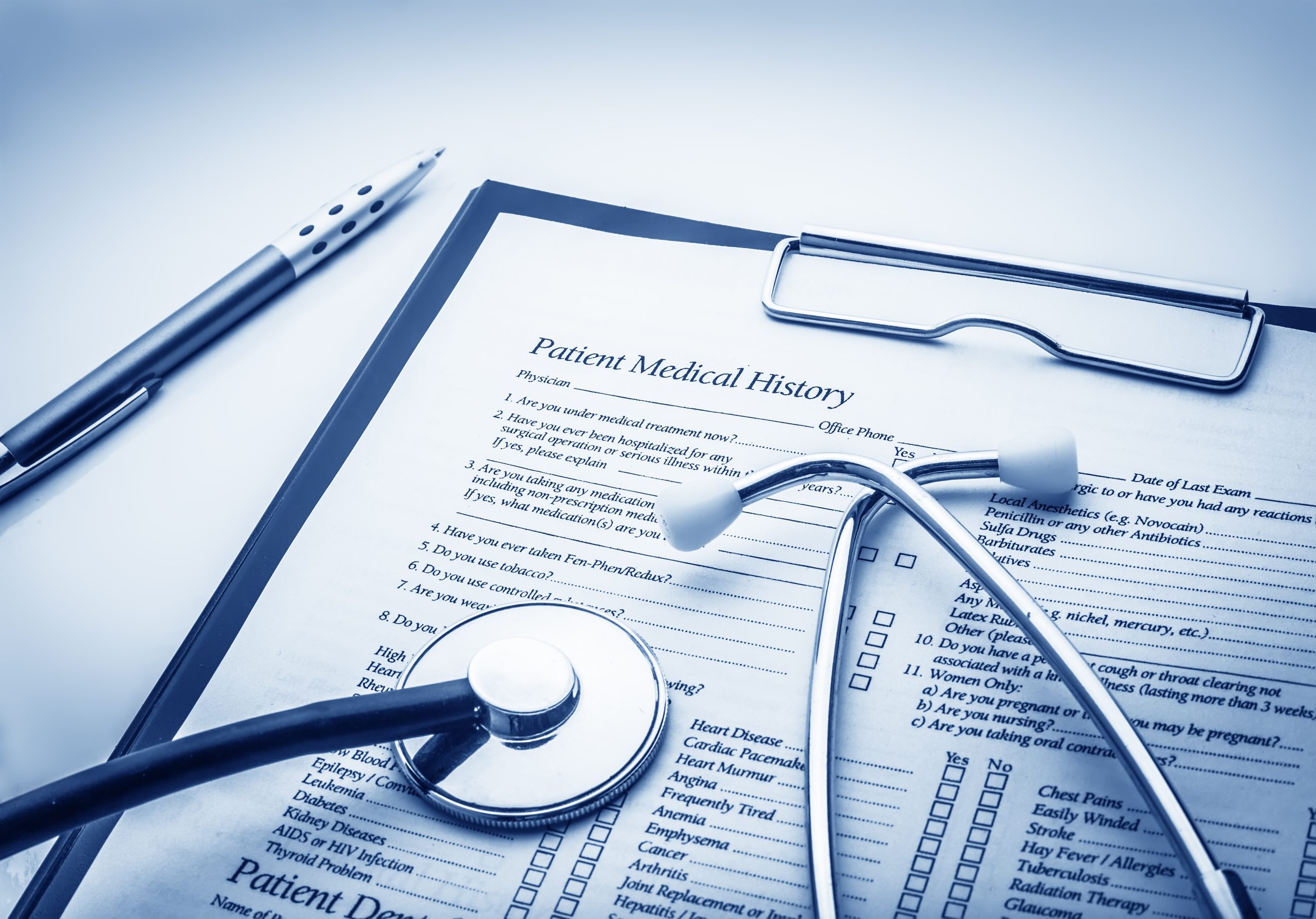 Stethoscope with calendar page date on wood table background doctor appointment medical concept